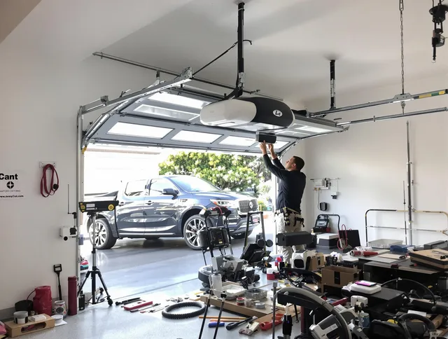 Akron Garage Door Repair specialist installing smart garage door opener system in Akron home